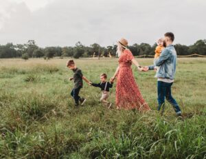 Family walking through a field